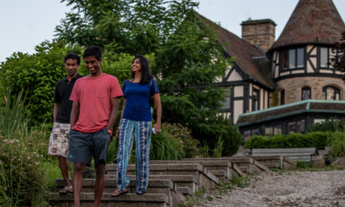 Happy family walking the stone stairs