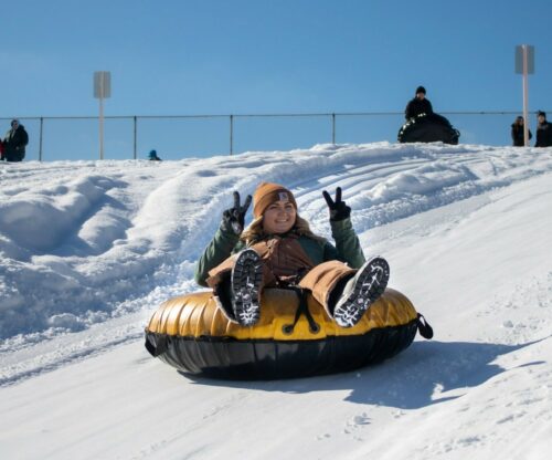 two people on snow tube