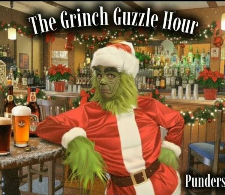 The grinch leaning against a table with beer bottles on top. There is a text overlay that reads, "The Grinch Guzzle Hour."