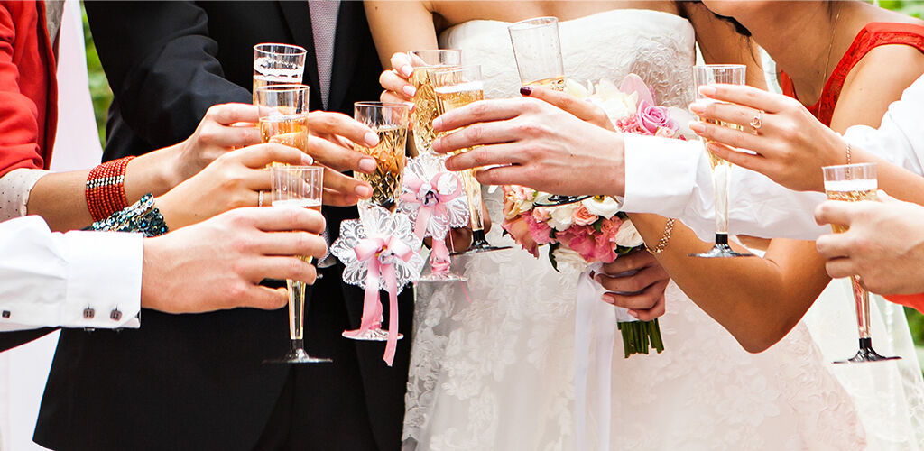 Wedding party toasting champagne glasses